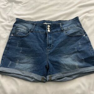 High waisted, distressed jeans